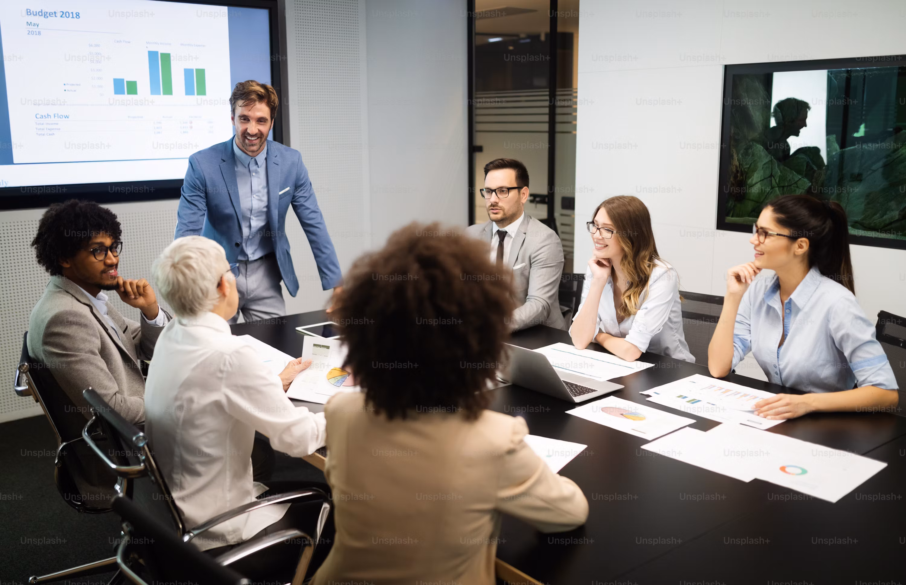 Team using AI workplace tools in a modern meeting