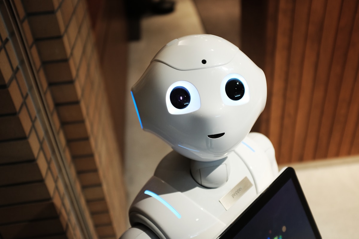 White robot arm in a research or industrial setting
