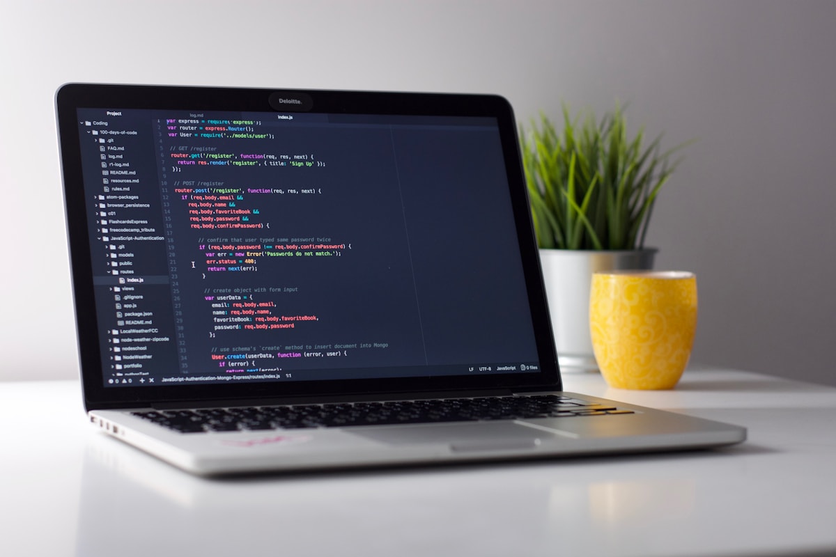 Developer writing AI and machine learning code on a laptop